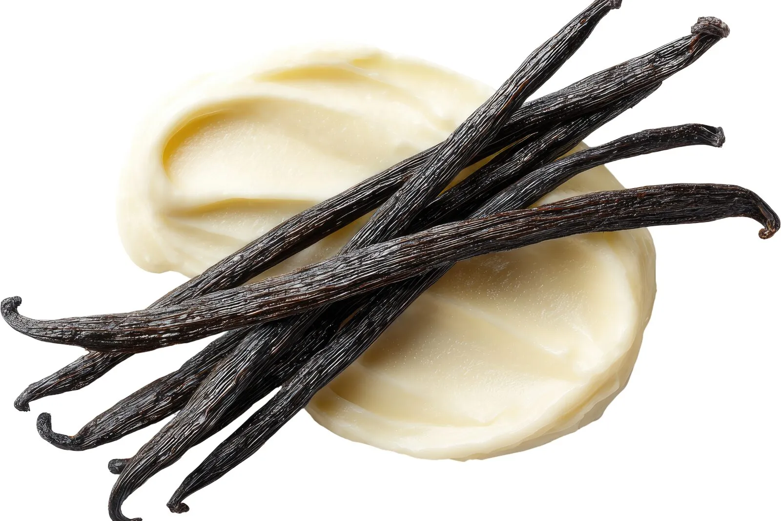 Cured Indonesian vanilla beans resting on a scoop of vanilla cream